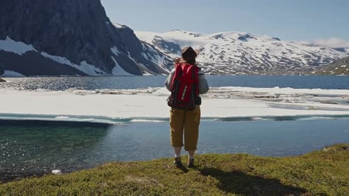 Hiker Girl Comes Down From the Mountain and Enjoys Incredible Views of the Mountain Peaks