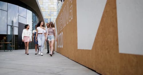 Group of teenagers walking through city