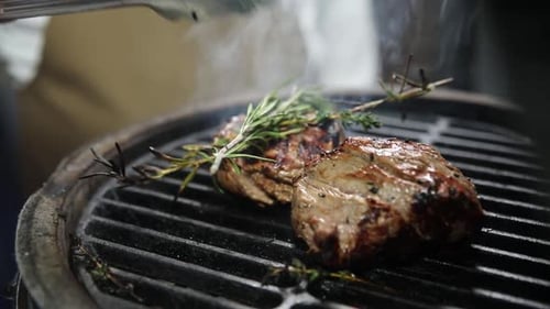 the chef prepares delicious meat in the restaurant