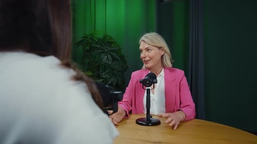 Professional Woman Recording Podcast Interview in Studio