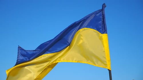 Ukrainian Flag Waving against Cloudless Sky