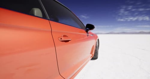 Orange Luxury Sports Car Parked on Vast Salt Flat