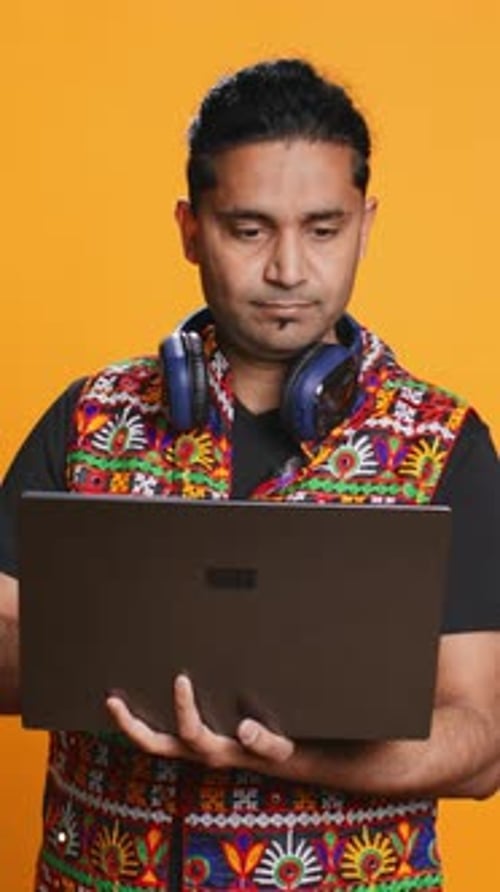 Vertical Video Man Typing on Laptop Frustrated with Malfunctioning Keyboard