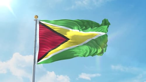 Dynamic Guyana National Flag Waving in the Wind with Sunny Blue Sky
