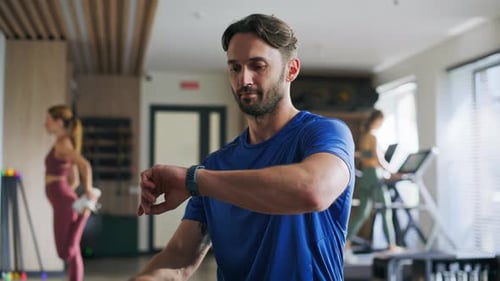 Sportsman Looking Wristwatch in Sport Club Portrait Athletic Man Smartwatch