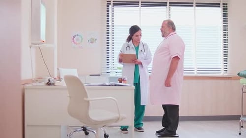 Doctor Measures Senior Patient's Weight in Clinic Room