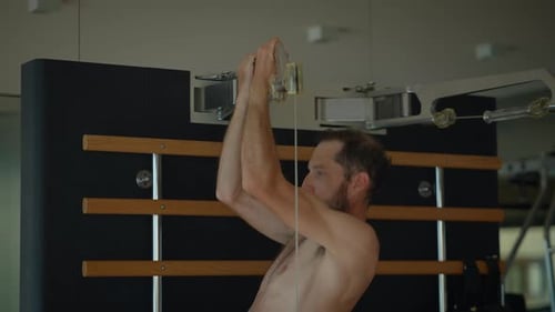 A Man Engaging in a Dynamic Gym Session A Comprehensive PullUp Workout Routine