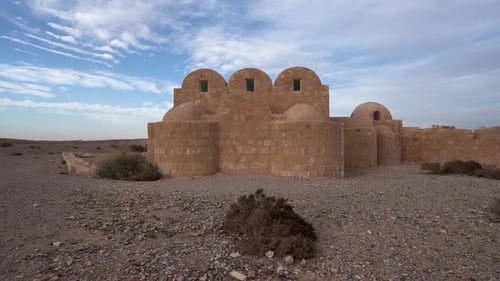 Push In Shot of UNESCO World Heritage Site Qasr Amra Desert Castle with Three Domes and Bath Complex