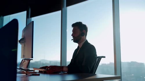 silhouette business man working in a modern office, online negotiations remotely. Male in suit