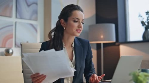 Excited Businesswoman Celebrates Success in Office