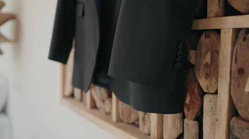 close up of groom suit jacket detail before wedding