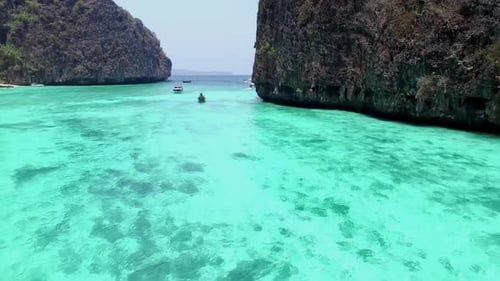 Aerial view of iconic tropical turquoise water Pileh Lagoon surrounded by limestone cliffs, Phi Phi