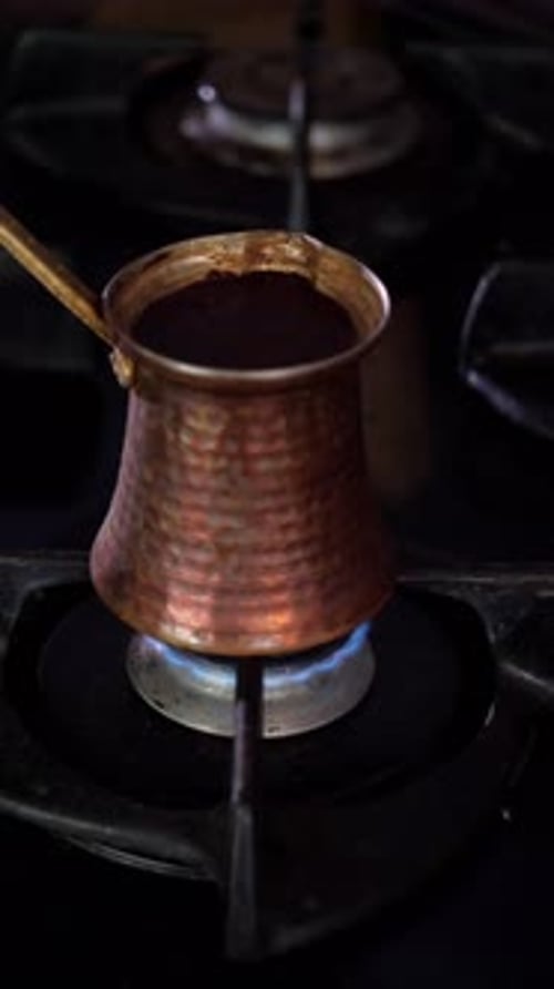 Turkish Coffee Brewing in a Cezve on a Gas Stove
