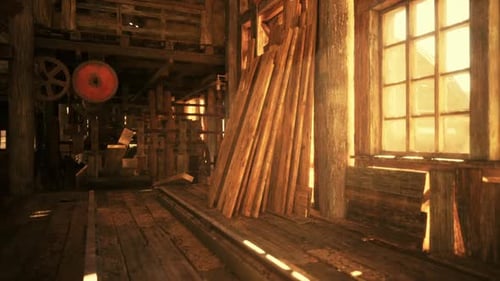 Warm Sunlight Filters Through Wooden Beams in an Old Workshop at Sunset