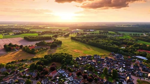 Footage over the picturesque rural area with densely built residential area.