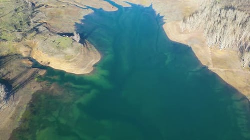 Aerial drone view of low levels of water in the lake. Shortage of water. Climate change.