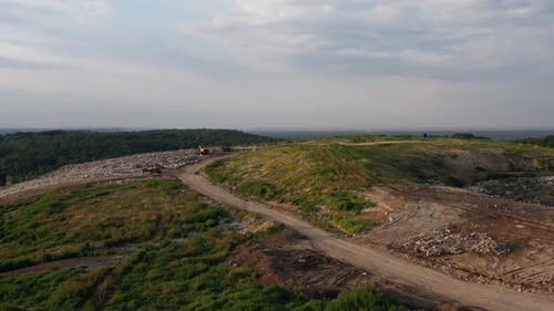 Top View of Garbage Landfill and Bulldozers