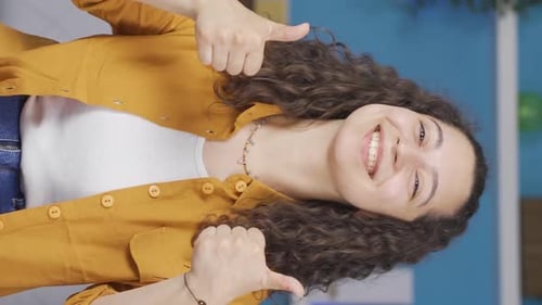 Cheerful Woman Gives Thumbs Up