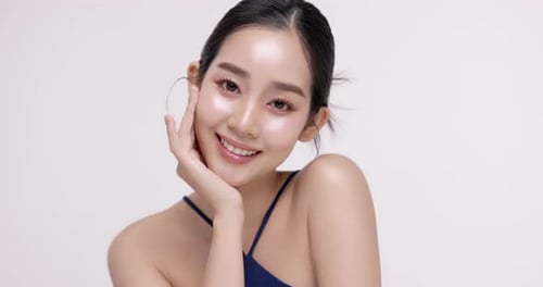 Slow motion of beautiful young Asian girl with k-beauty make up style.