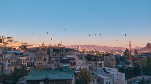 Sunrise Hot Air Balloons Over the City