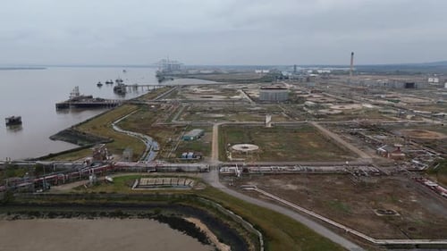 Aerial view of industrial port with cranes, United Kingdom.