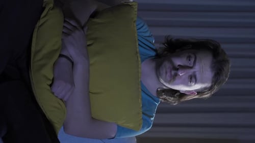 Vertical Video of Depressed man at home thoughtful.
