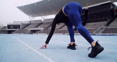 Woman Athlete Runs on Track Field, Training
