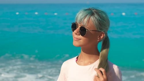 Stylish Girl on Pebbles Shore