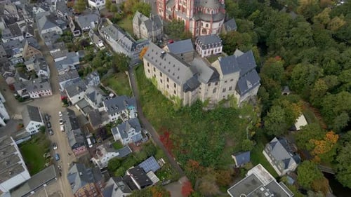 Aerial view of historical architecture and autumn foliage, Germany.