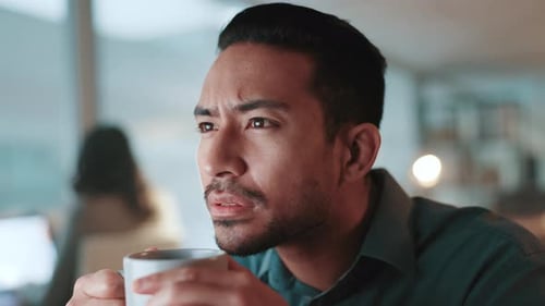 Man Contemplating, Drinking Coffee in the Office