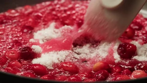 Frozen Cranberries Cooking for Tea or Jam Background Close Up of Cranberry Berries in on the Kitchen
