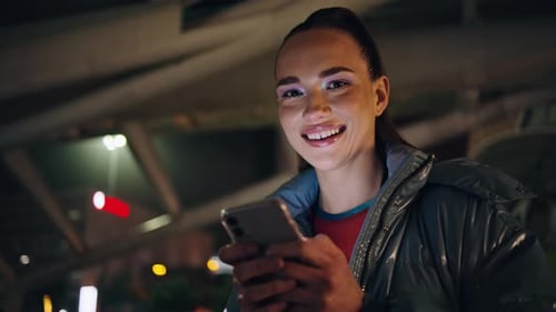 Smiling Girl Looking Smartphone at Evening City Close Up Modern Night Life