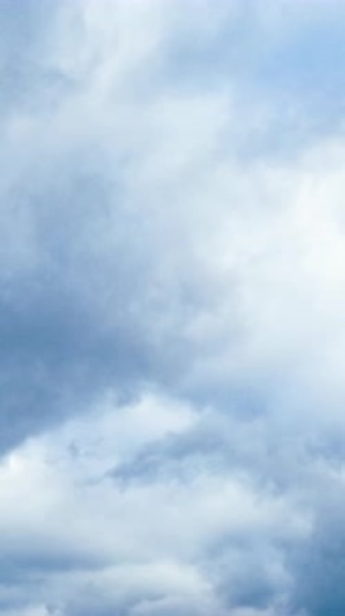 Clouds Drifting Gently Across the Blue Sky