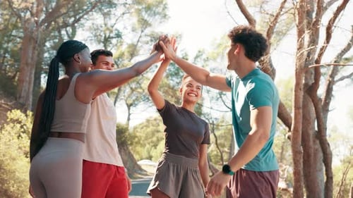 Team, high five and happy for fitness at park with cheers, applause or support for challenge