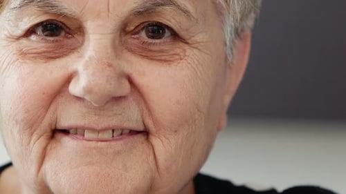 carefree and smiling old lady