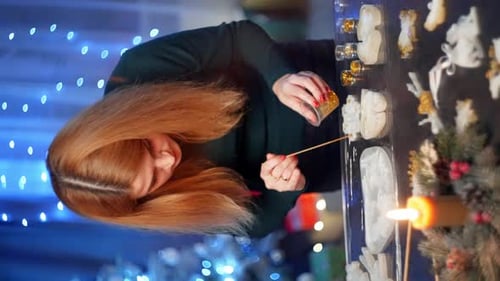 Woman Crafts Christmas Ornaments for the Holidays