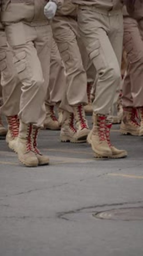 Closeup View of Uniformed Troops in Tan Utility Uniforms Marching in Precise Formation Rugged Combat