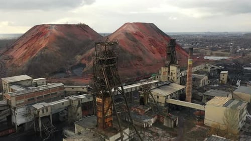 Old Coal Mine Elevator and Slag Heaps on a Cloudy Day Vintage Coal Mining Shaft Building Weathered