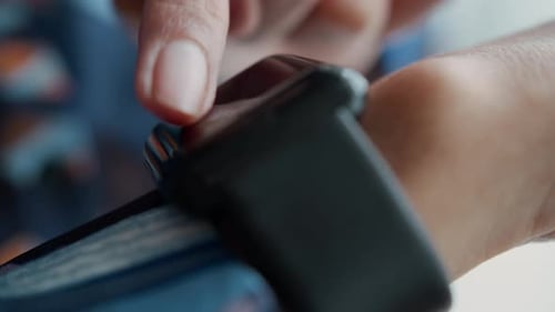 Person using App on Smartwatch Extreme Close Up