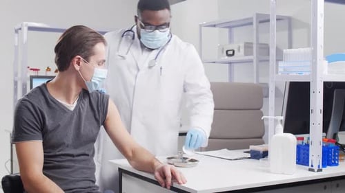 Adult Receives Vaccine in Doctor's Office