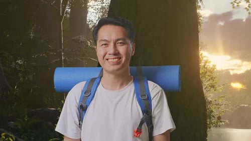 Close Up Of Asian Male Smiling To Camera While Exploring Nature