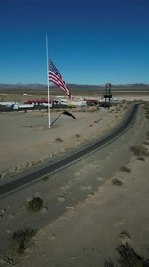 American Flag Fluttering Against Blue Sky