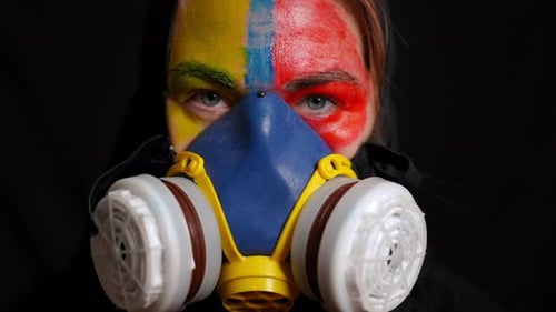 Person With Painted Face Wearing Gas Mask