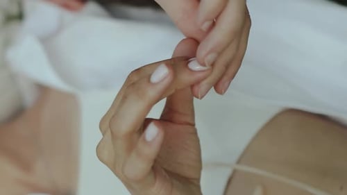 Elegant Hands with Manicured Shiny White Nails