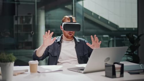 Futuristic Workflow Man Uses 3D Augmented Reality Glasses in Modern Office