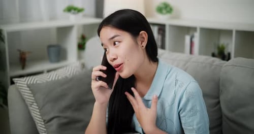 Woman Smiling Talking on Cell Phone at Home