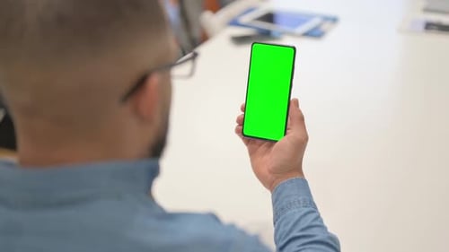 Hispanic Using Phone with Green Screen