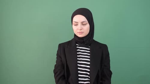 Thoughtful Woman In Hijab Contemplates Sadness