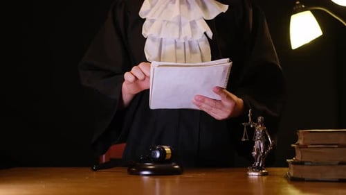 A Judge Prepares for Court with Key Documents Highlighting the Importance of Justice in the