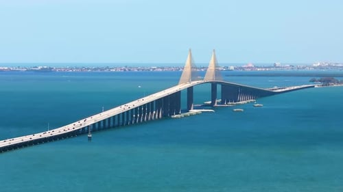 Sunshine Skyway Bridge Over Tampa Bay in St Petersburg in Florida with Driving Traffic Cars